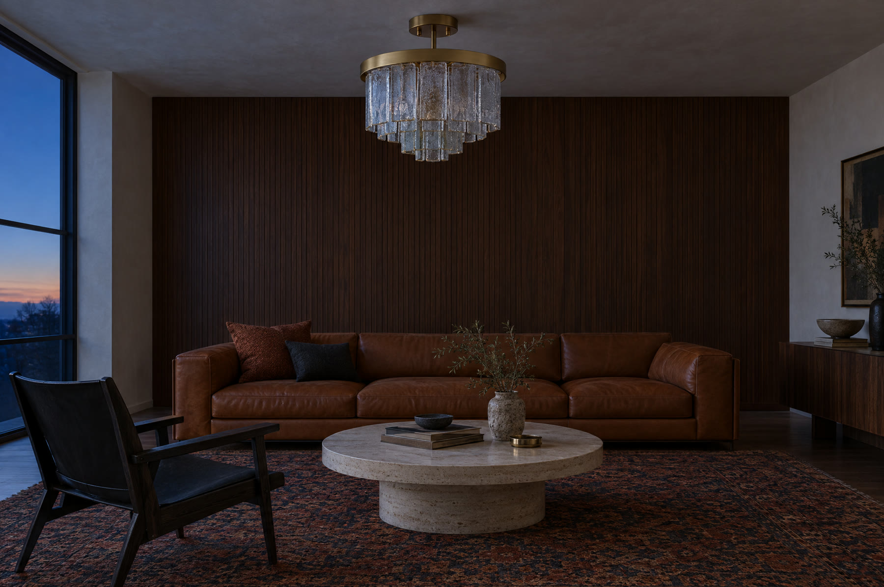A living room at blue dusk with a glass chandelier switched off.